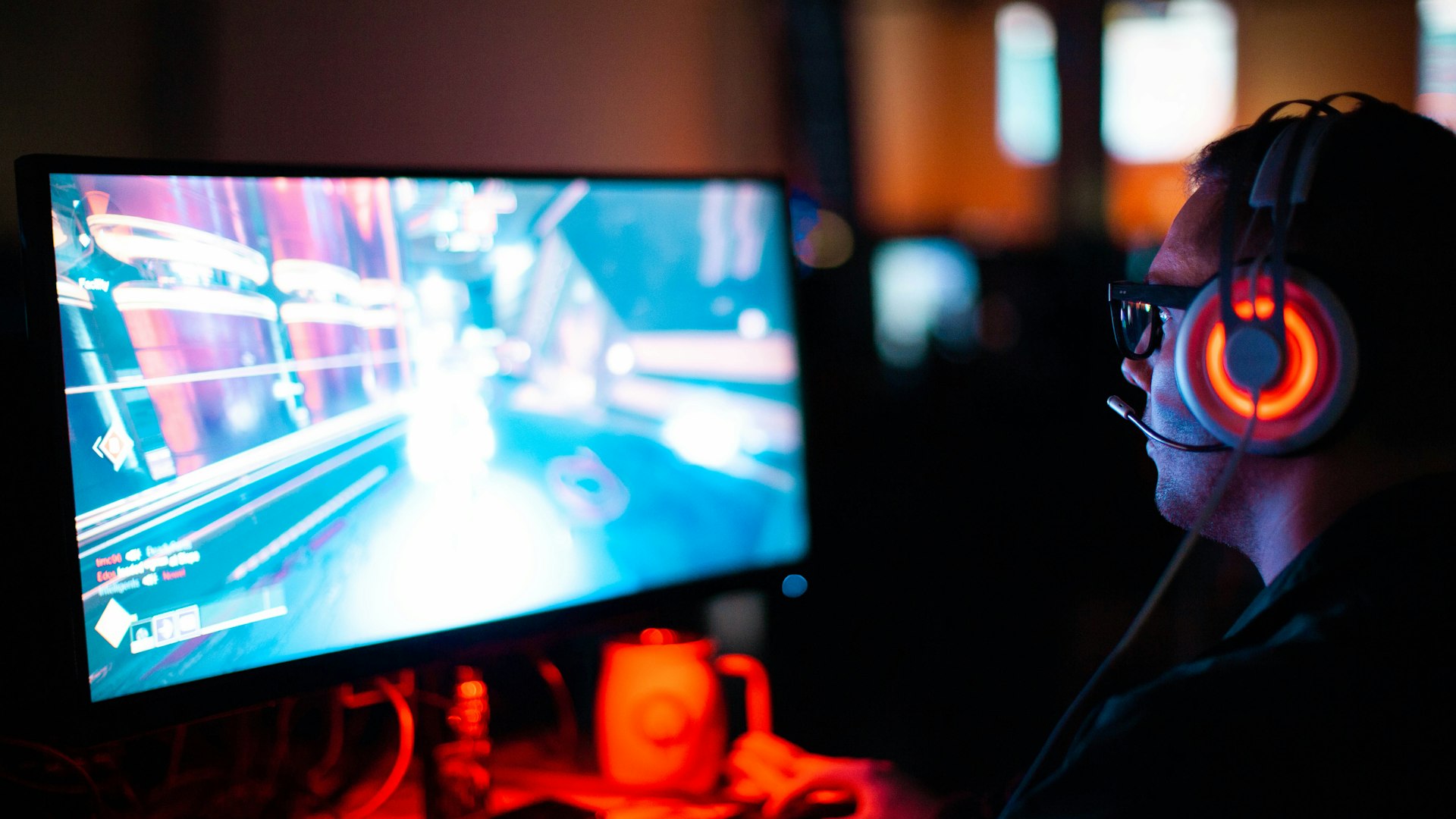 The main floor of Nova Gaming Arena with rows of lit gaming PC bays